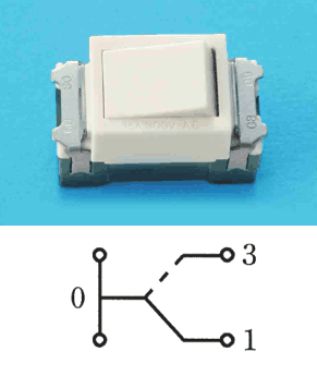 白い角形の器具で，ハンドルに窓は無い。その下の接点の図は，端子0から端子1と端子3へ切り替わる接点（端子3側は破線）がある
