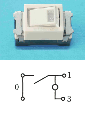 白色の器具の写真。ハンドルに小さな窓がある。下の図は,左に0の字と上下2つの端子を縦線で結んだ部分があり,その上の端子から出た線と右の1の端子へ続く線の間が斜めの線で開いた接点になっていて,1の端子へ続く線から下へ白丸を経て3の端子に至る構成